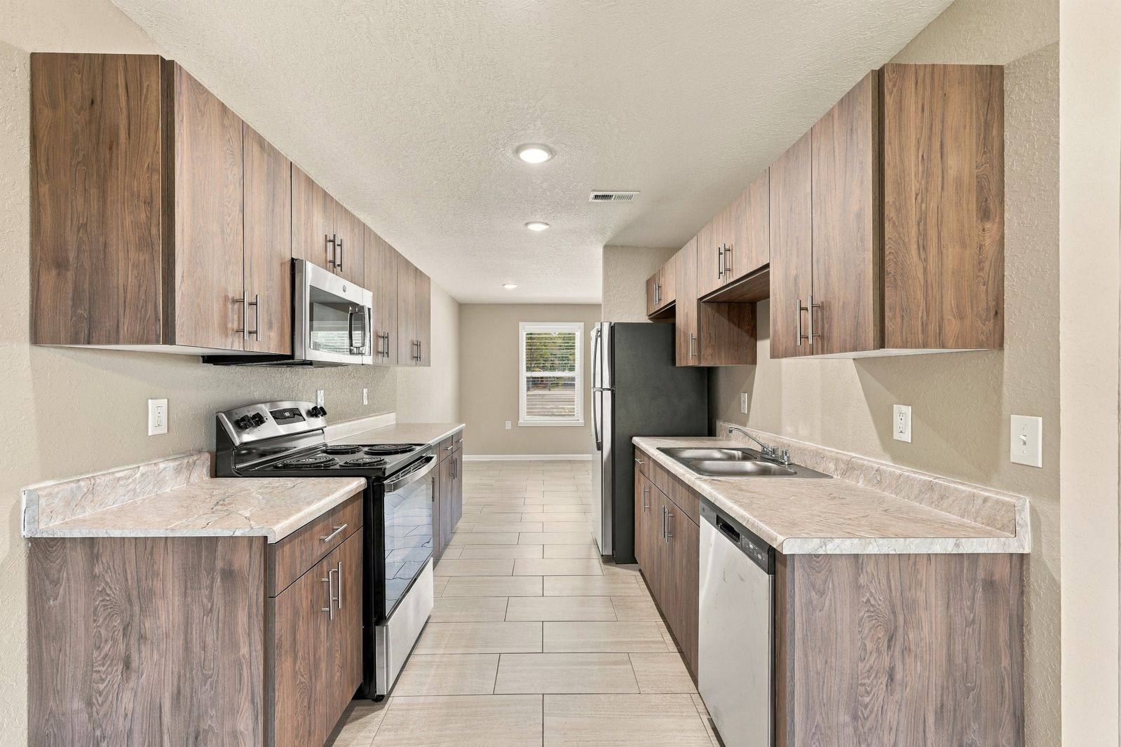 Kitchen with wood cabinets and stainless steel appliances